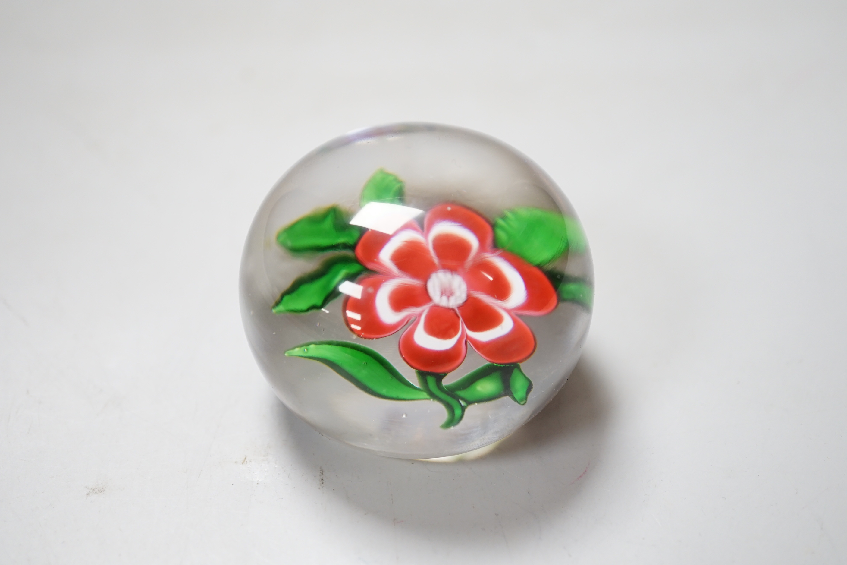 A Baccarat primrose paperweight, approximately 5cm diameter